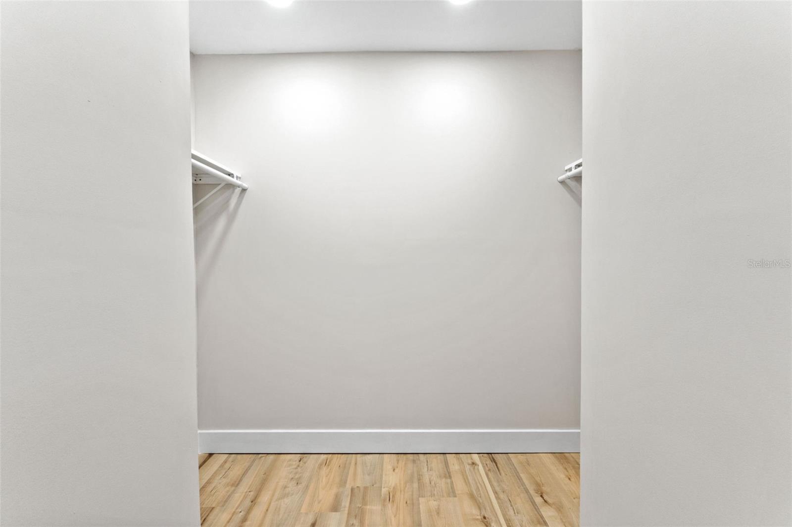 Primary bedroom walk-in closet