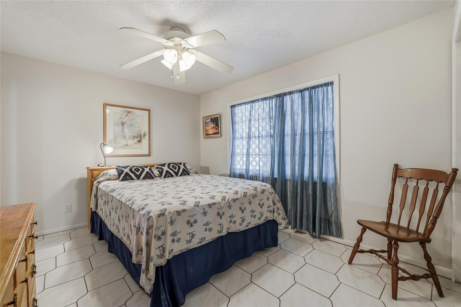 Bedroom 1 with lovely ceramic tile.