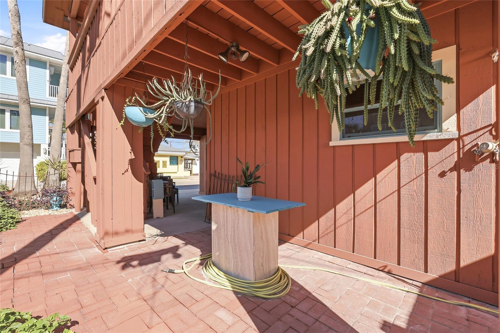 Covered patio space downstairs.
