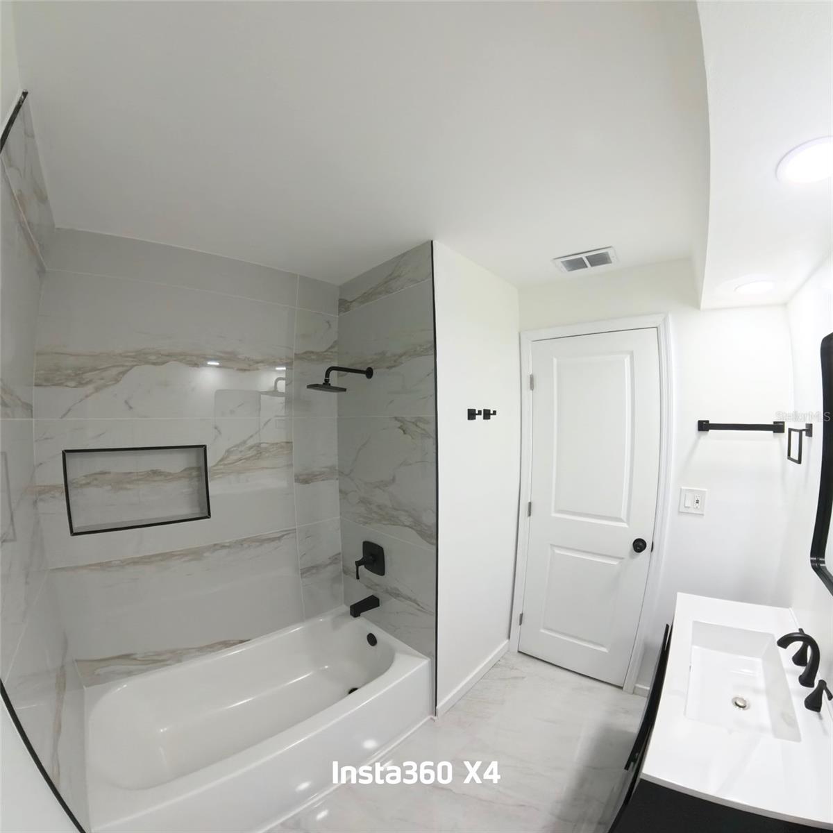 One of three renovated bathrooms