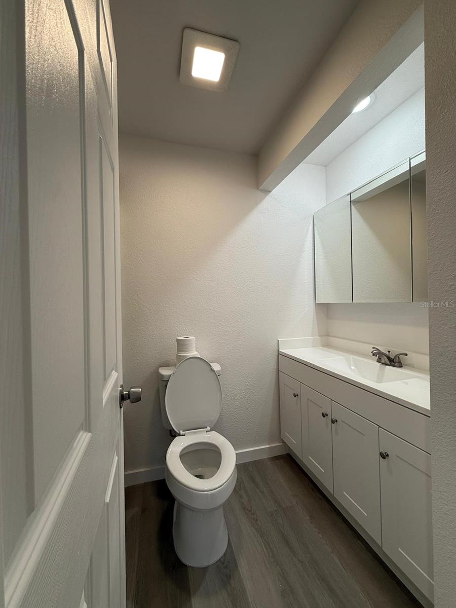 Full bath layout, shower is to left of lavatory.