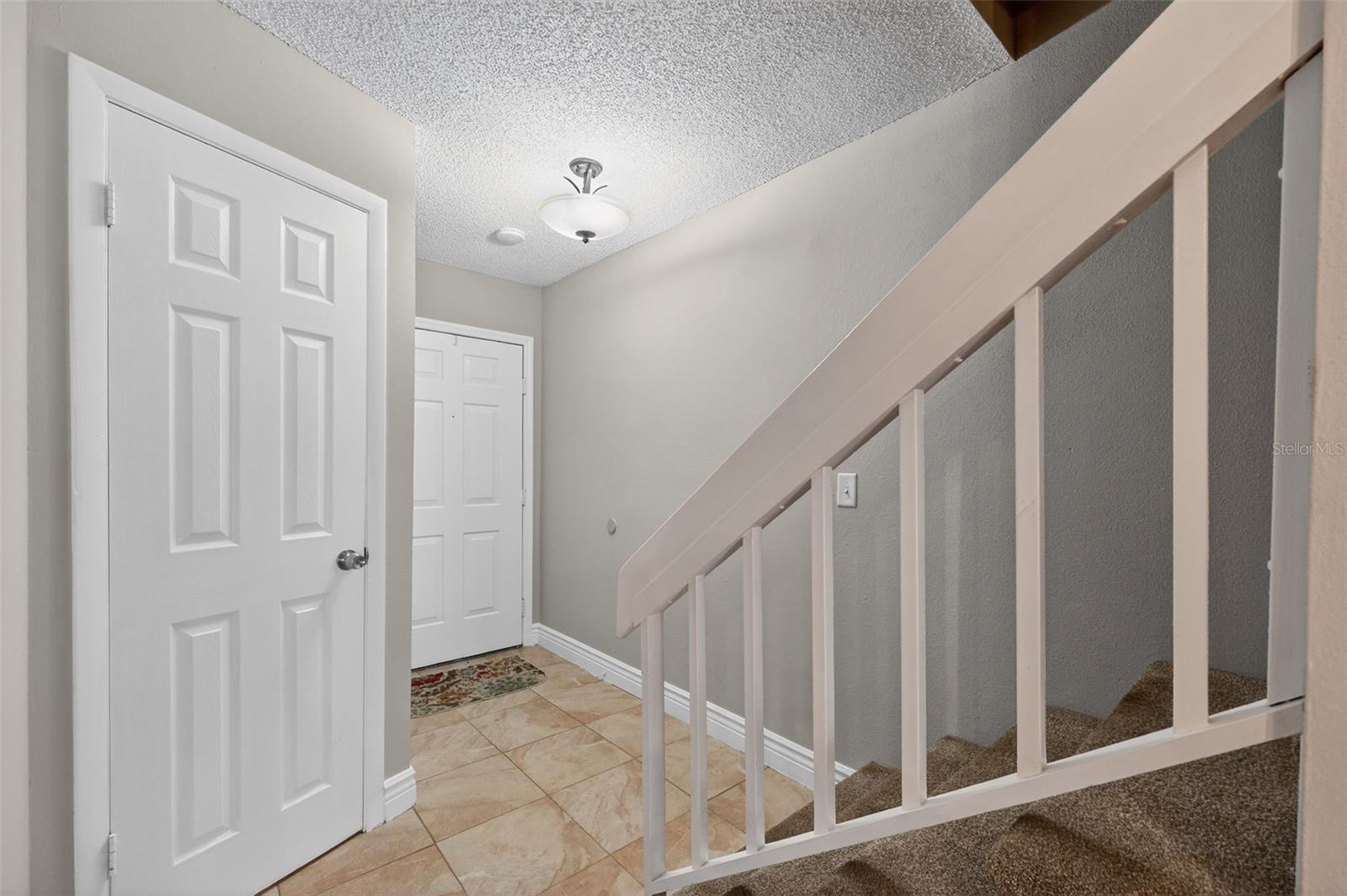 Looking Back at Foyer 1/2 Bath Door on Left