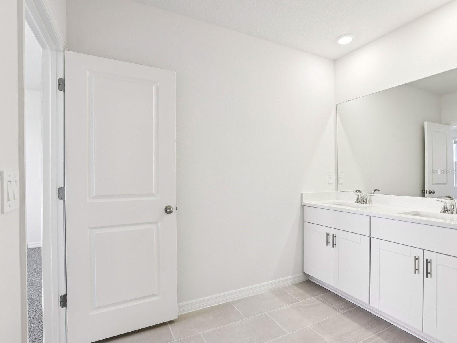 Interior photos are not of the actual home but are photos of the builder home with same floorplan with similar interior finishes and features.