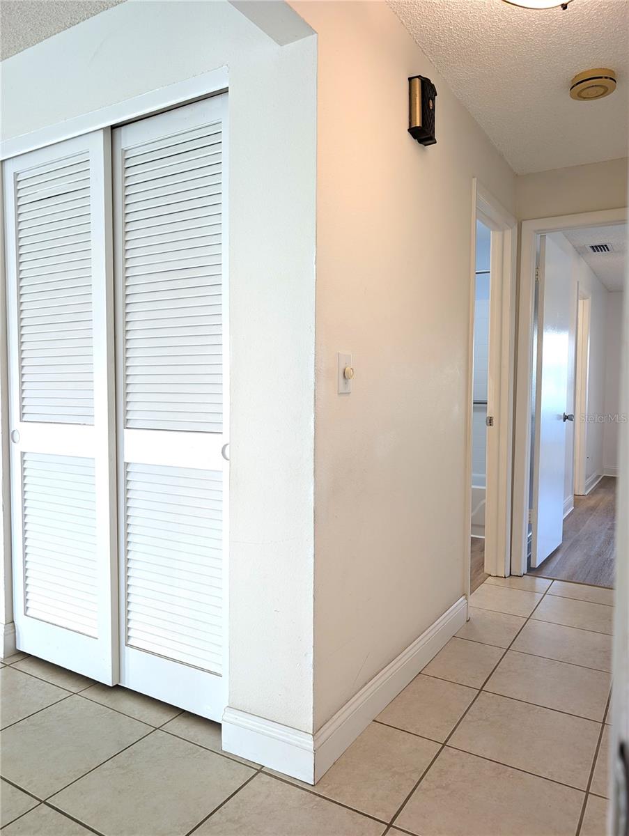 View from Guest Bedroom down Bedroom Hallway and at Linen Closet