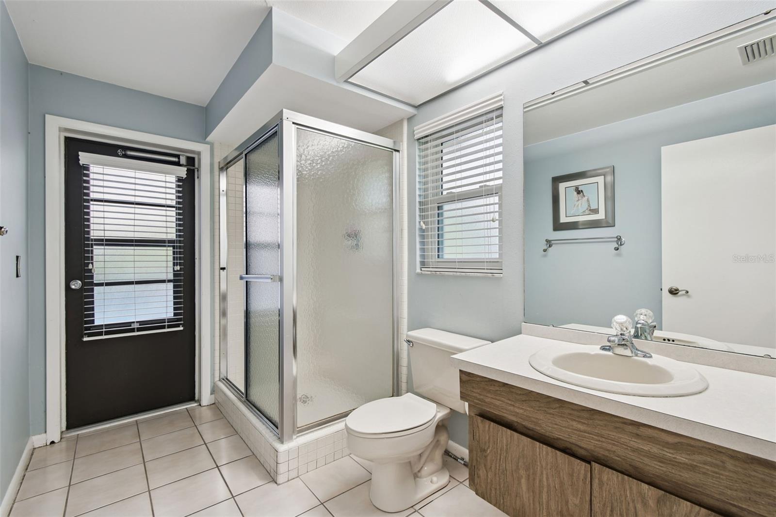 Bathroom 3 with entry to pool area