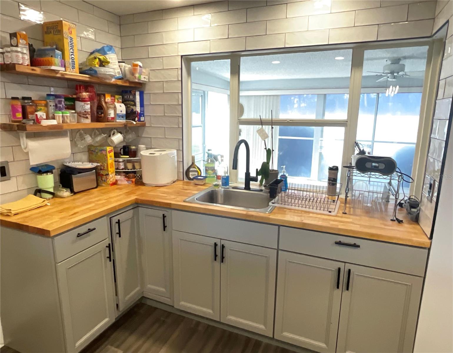 Kitchen sink area view towards front Florida room