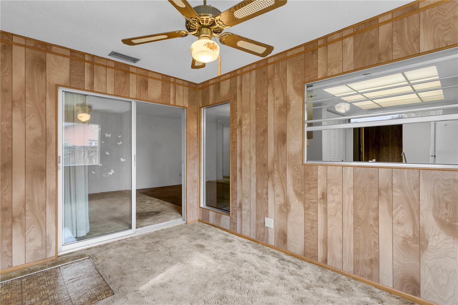 Office features a window into the kitchen