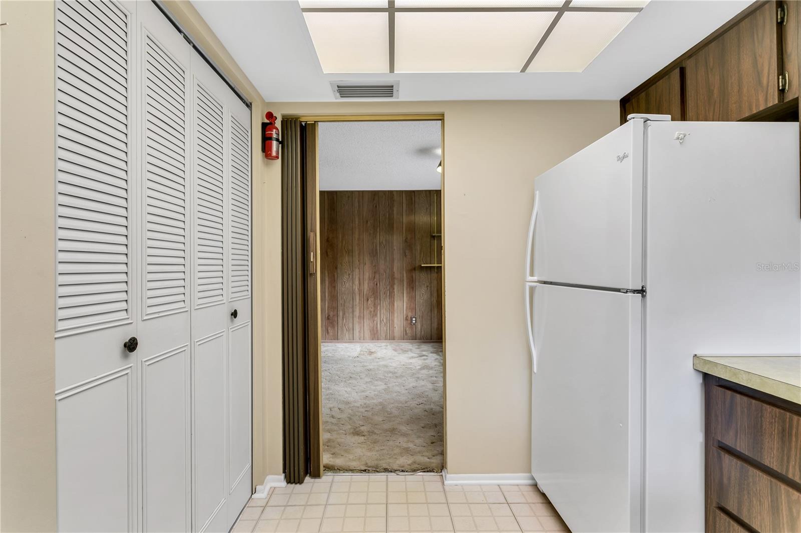 Large pantry closet in kitchen for added storage and convenience