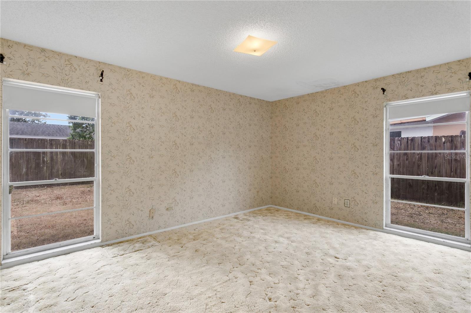 Primary bedroom with south and west exposure windows