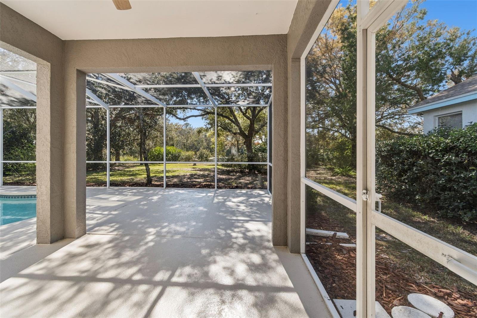 Screened and covered patio area