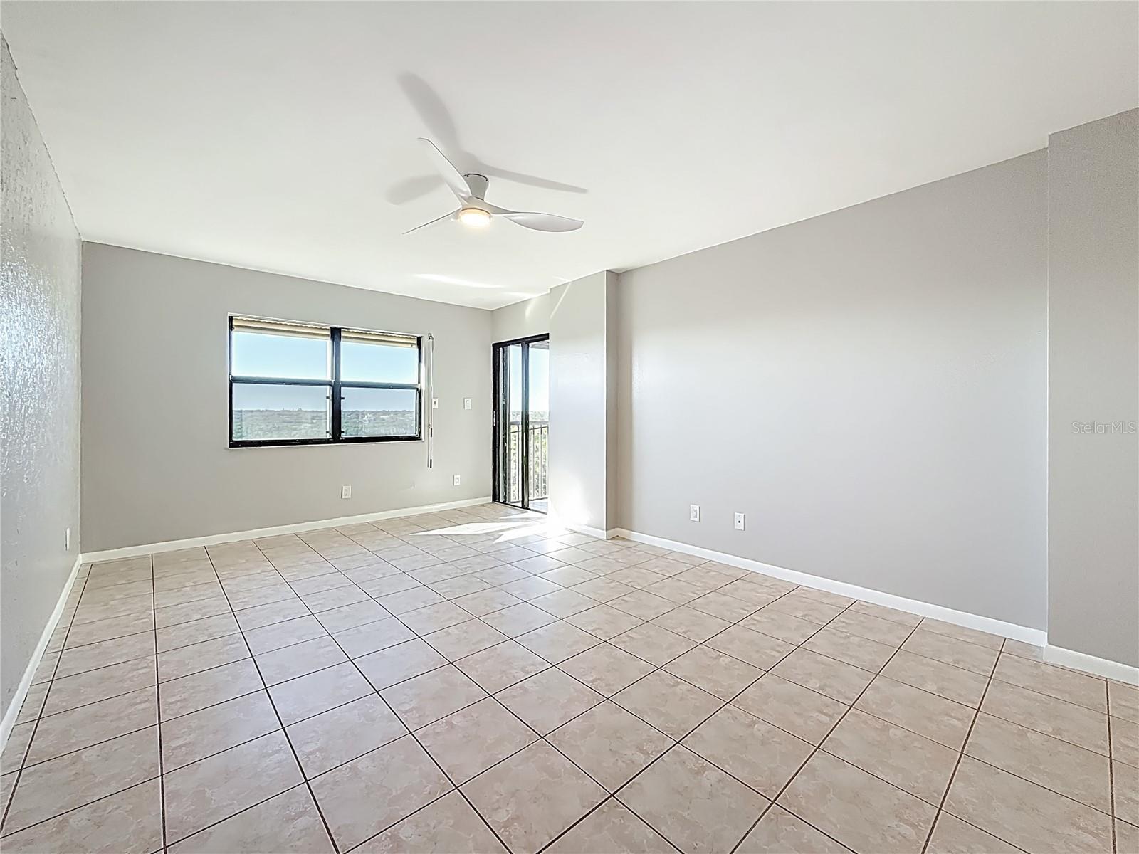 Primary bedroom with balcony access