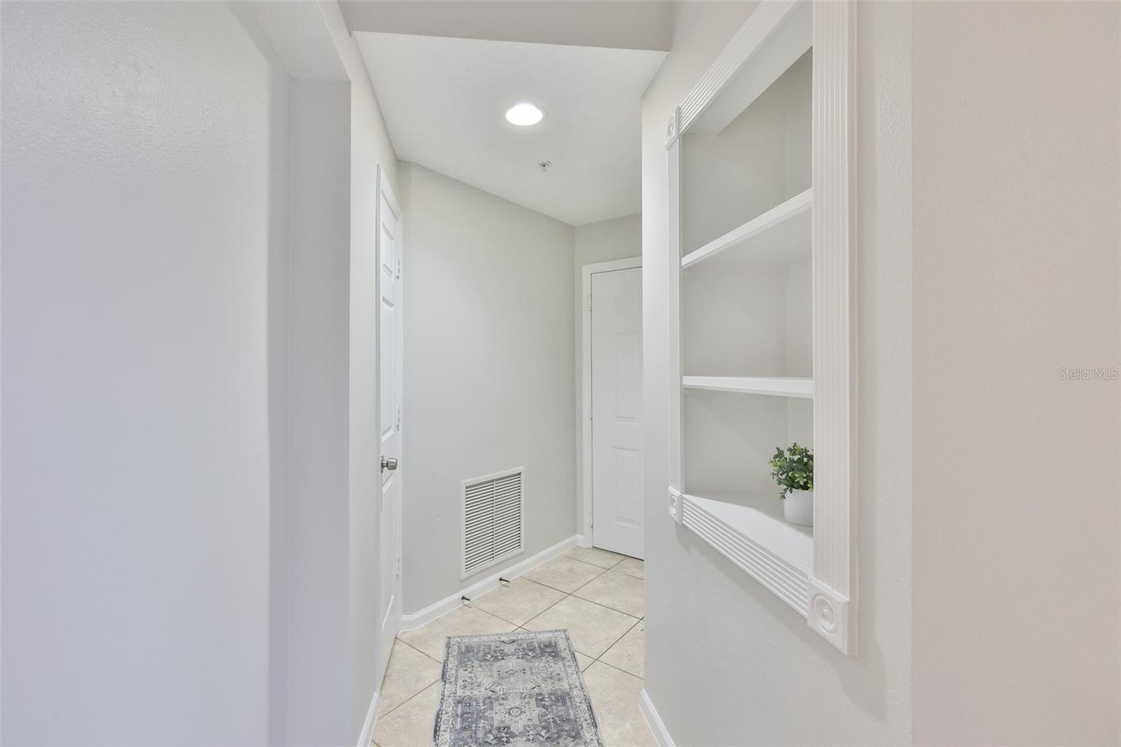 Foyer with Closet and Built-In Shelving