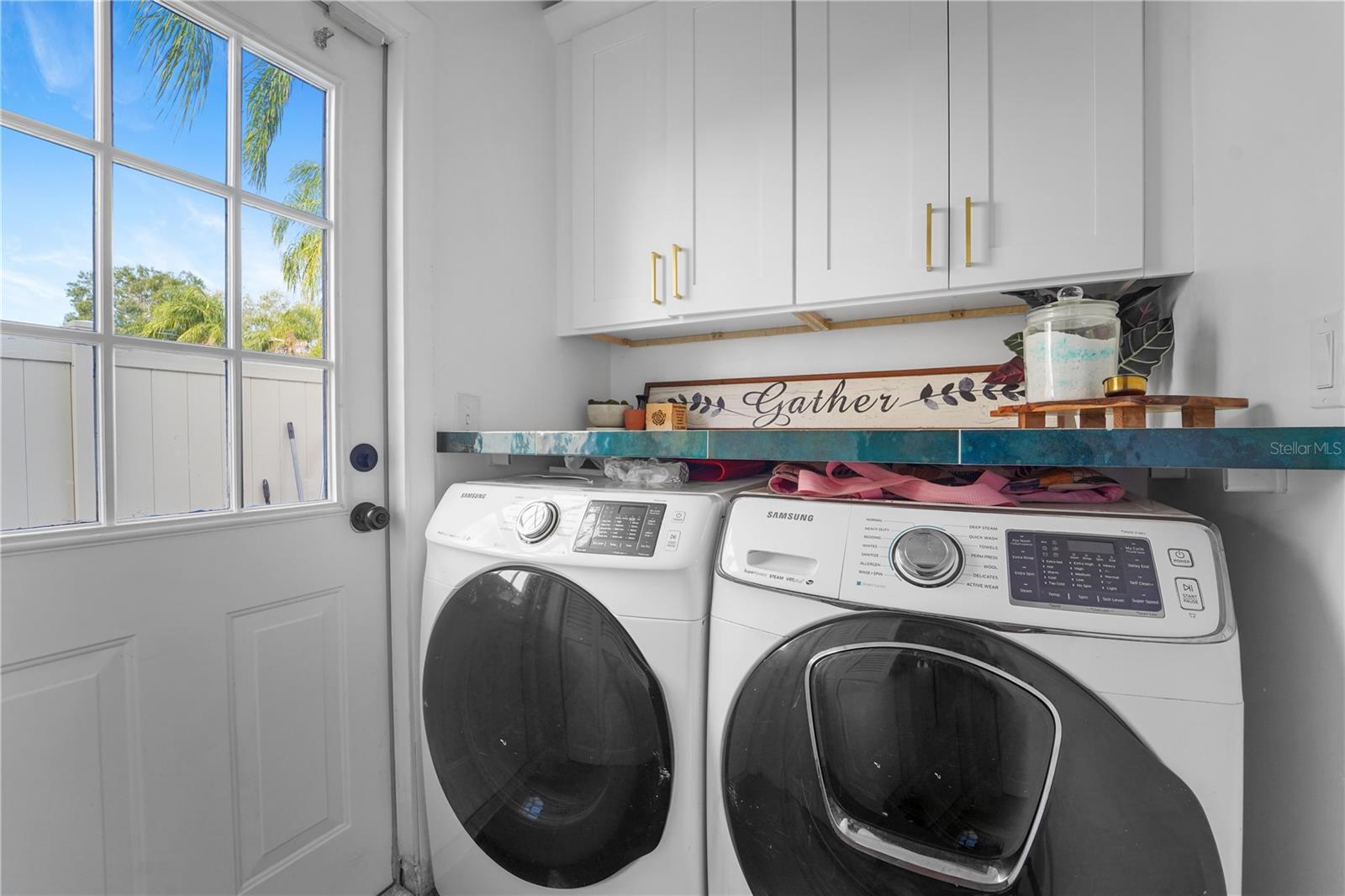 Laundry Room with cabinets and counter tops