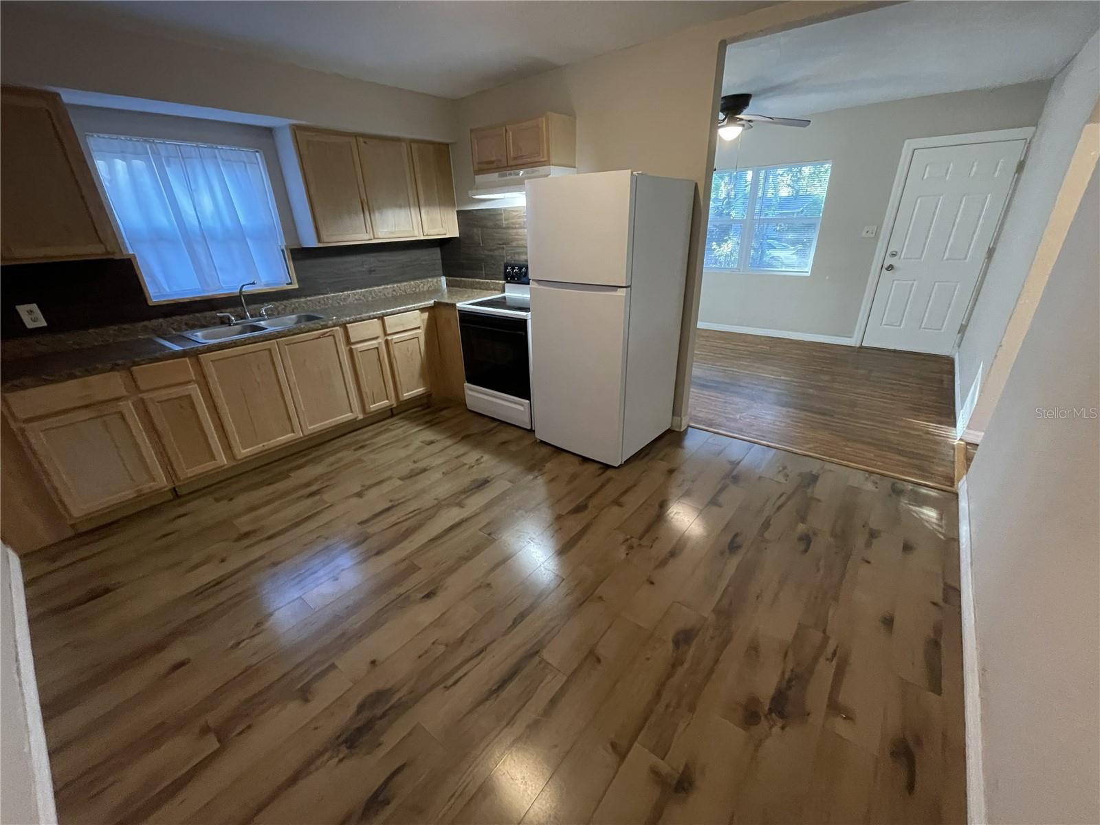 Kitchen with opening to the living room