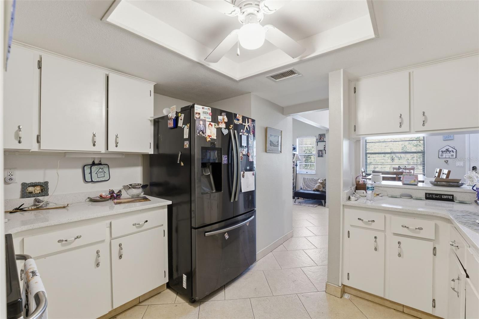Bright kitchen with ample cabinet storage and newer appliances.