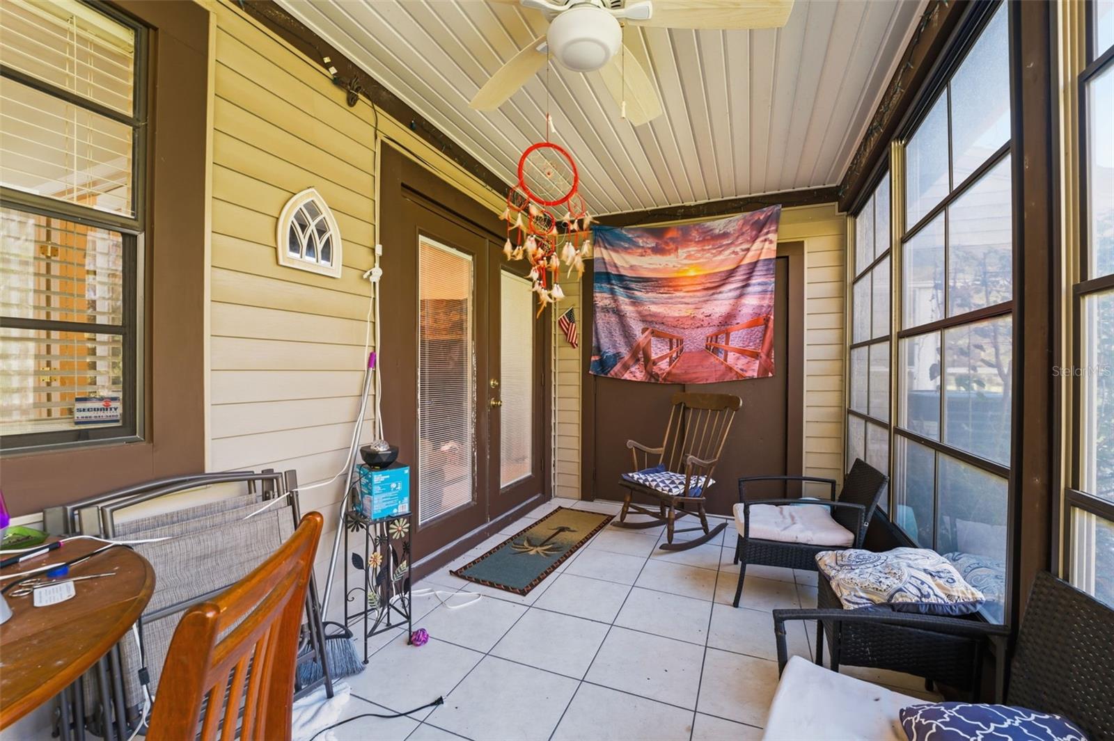 Screened-in lanai offering a relaxing outdoor living space.