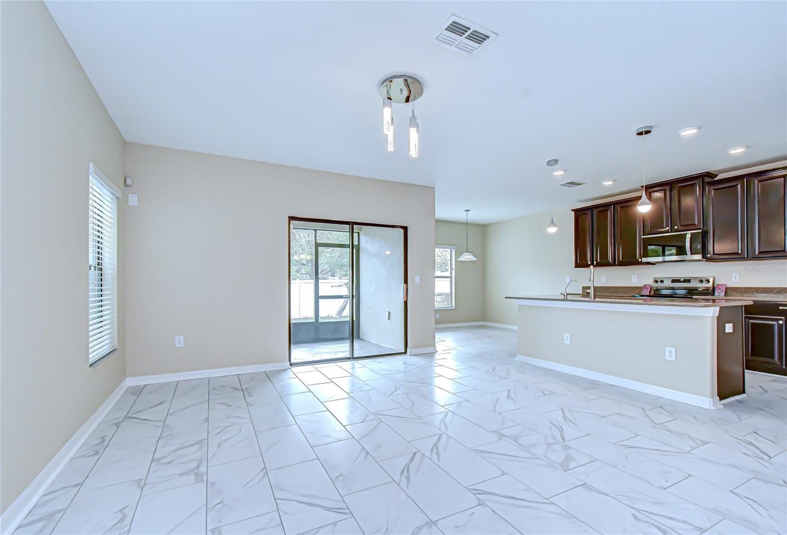 Spacious great room with sliders!