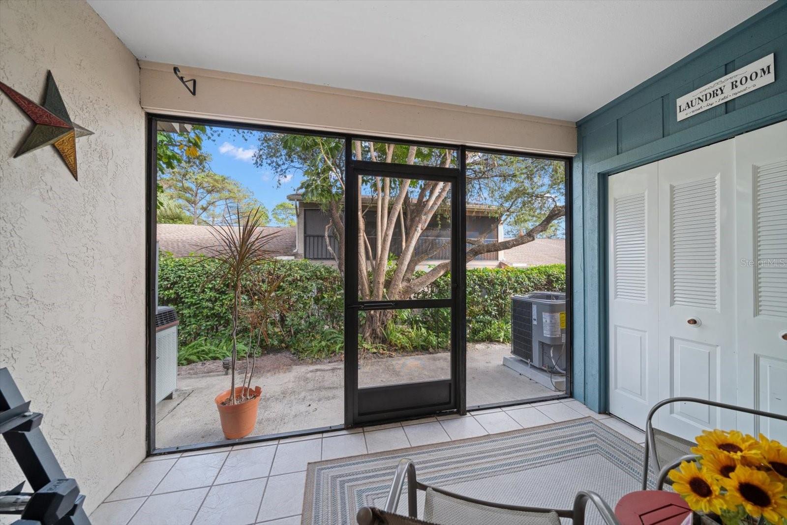 Cool and warm Florida evenings await in this private screened patio.