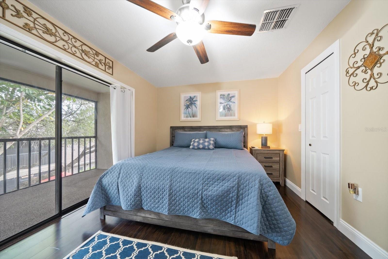 The primary bedroom is spacious and offers a large walk-in closet.