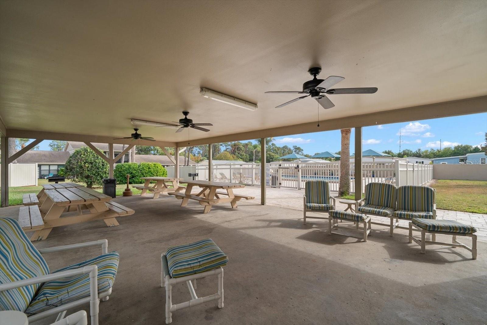 Lots of covered areas are found around the pool and amenities perfect for lounging or gatherings.