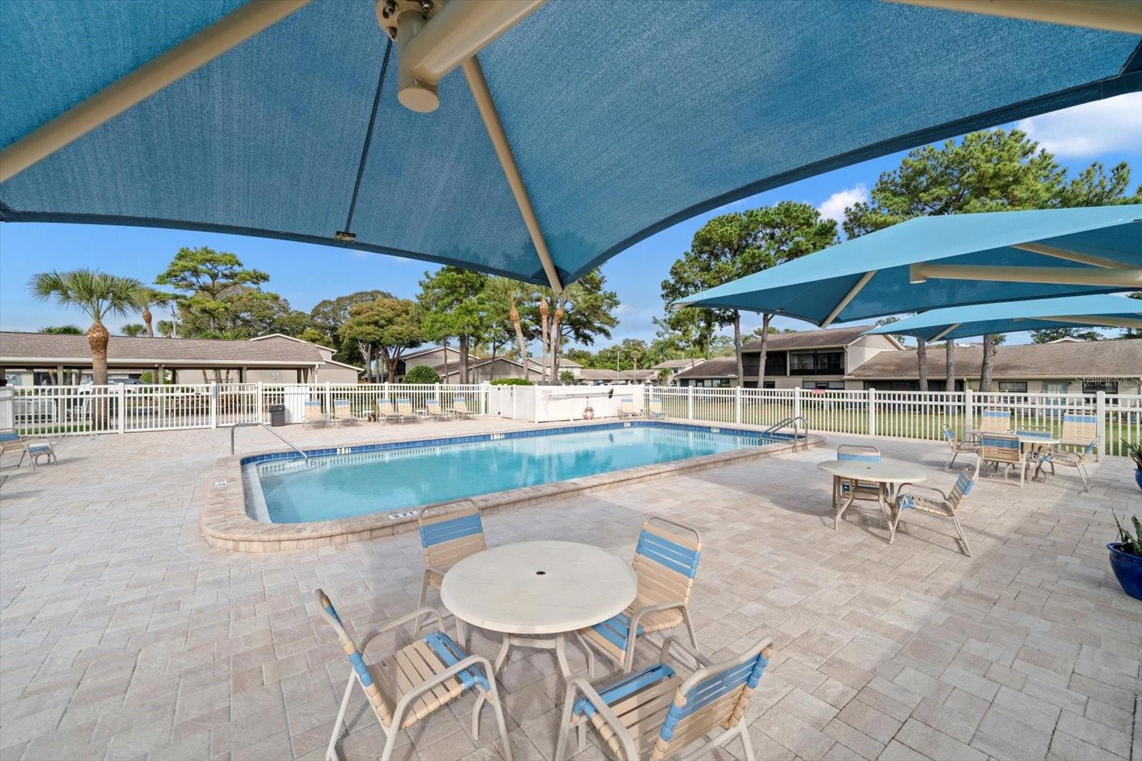 Community pool area, great for summer days and a picnic.