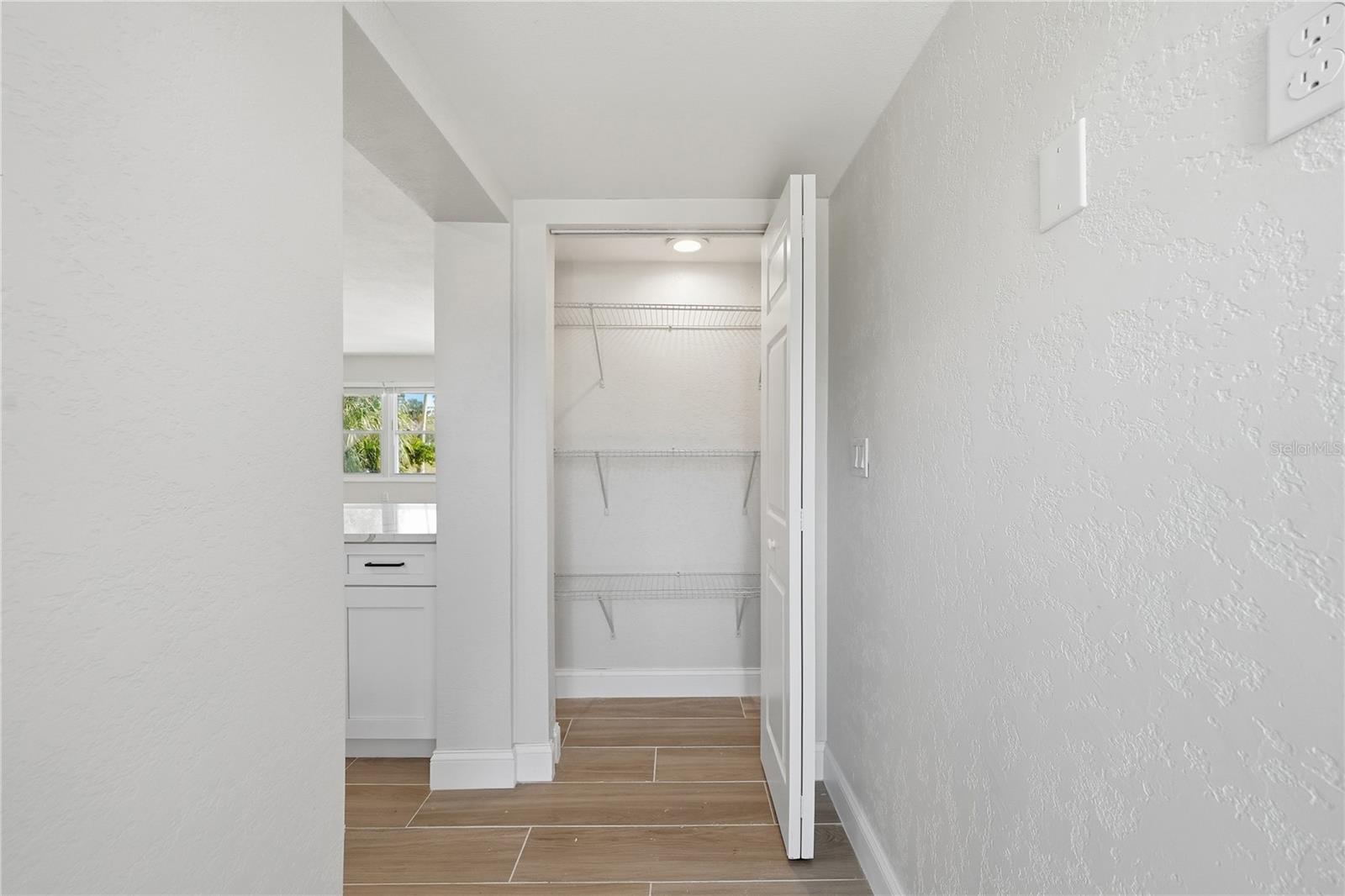 Pantry off the kitchen with access to the backyard