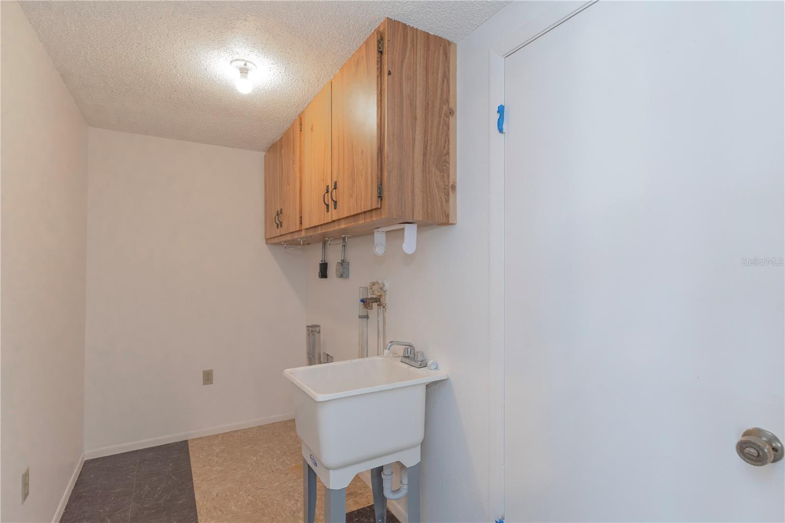 Inside Landry room. There's also a second washer / dryer connection in the garage.