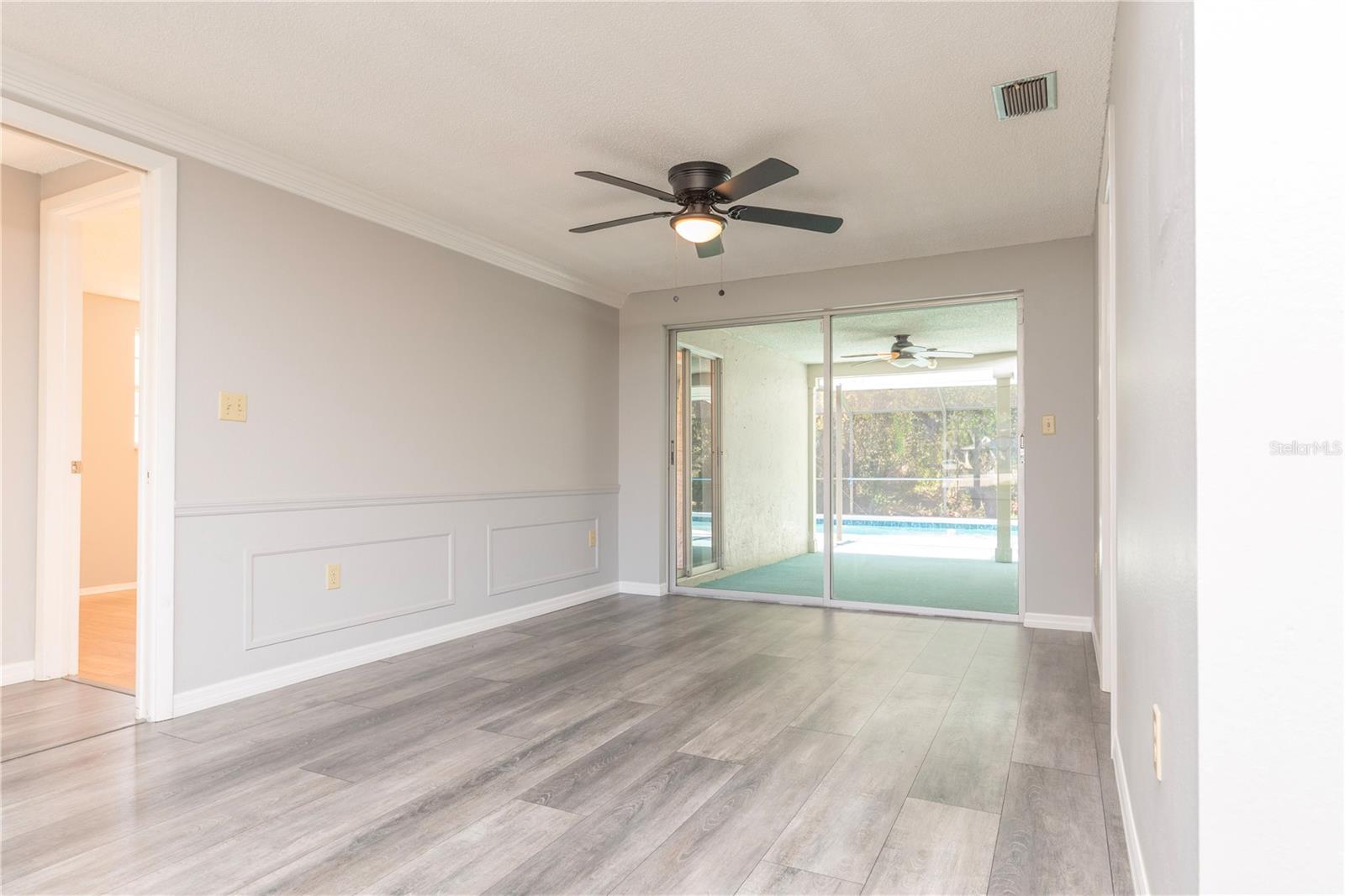 Dining room with slider to pool lanai.