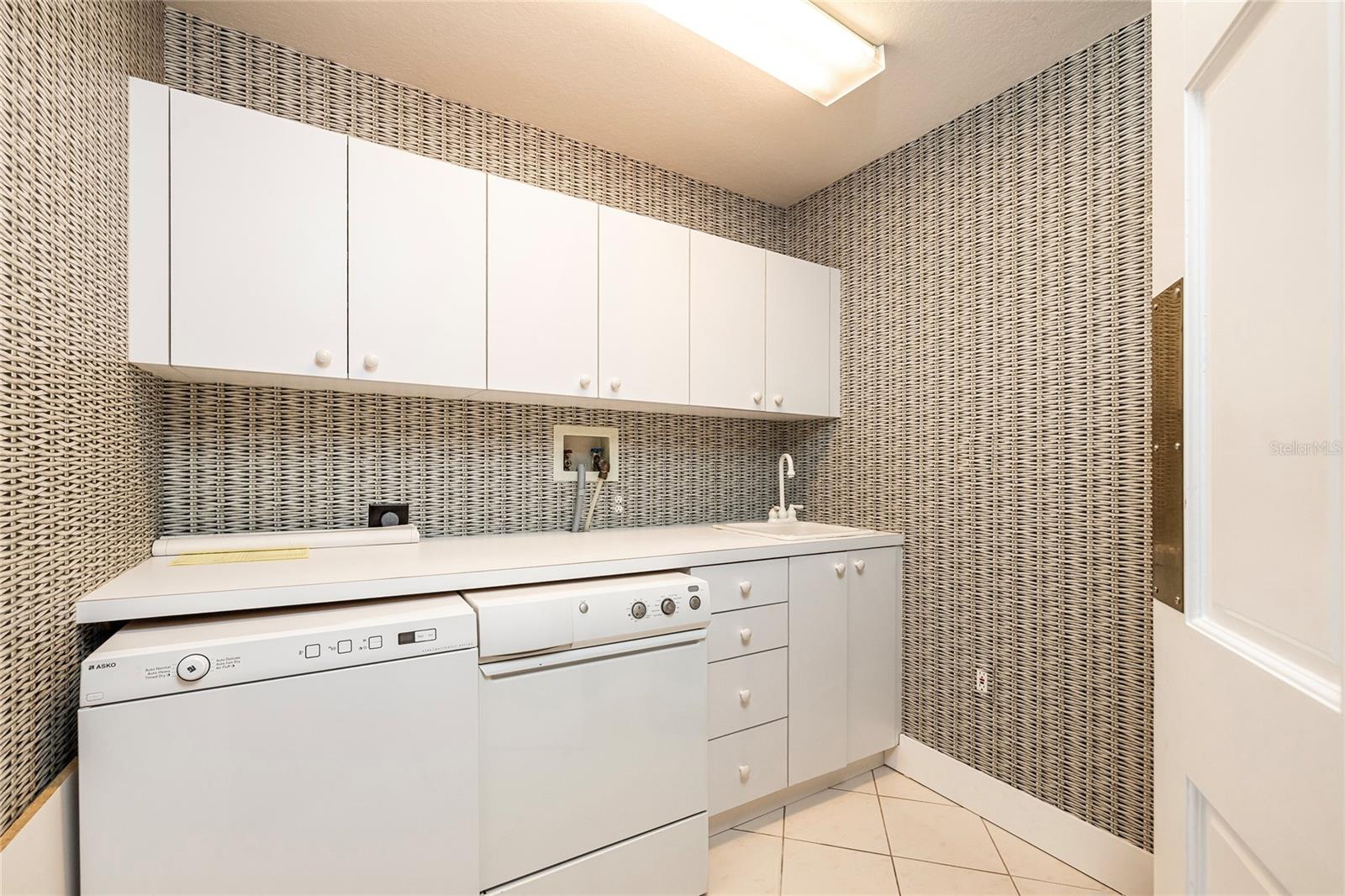 Large Laundry room with ample storaage