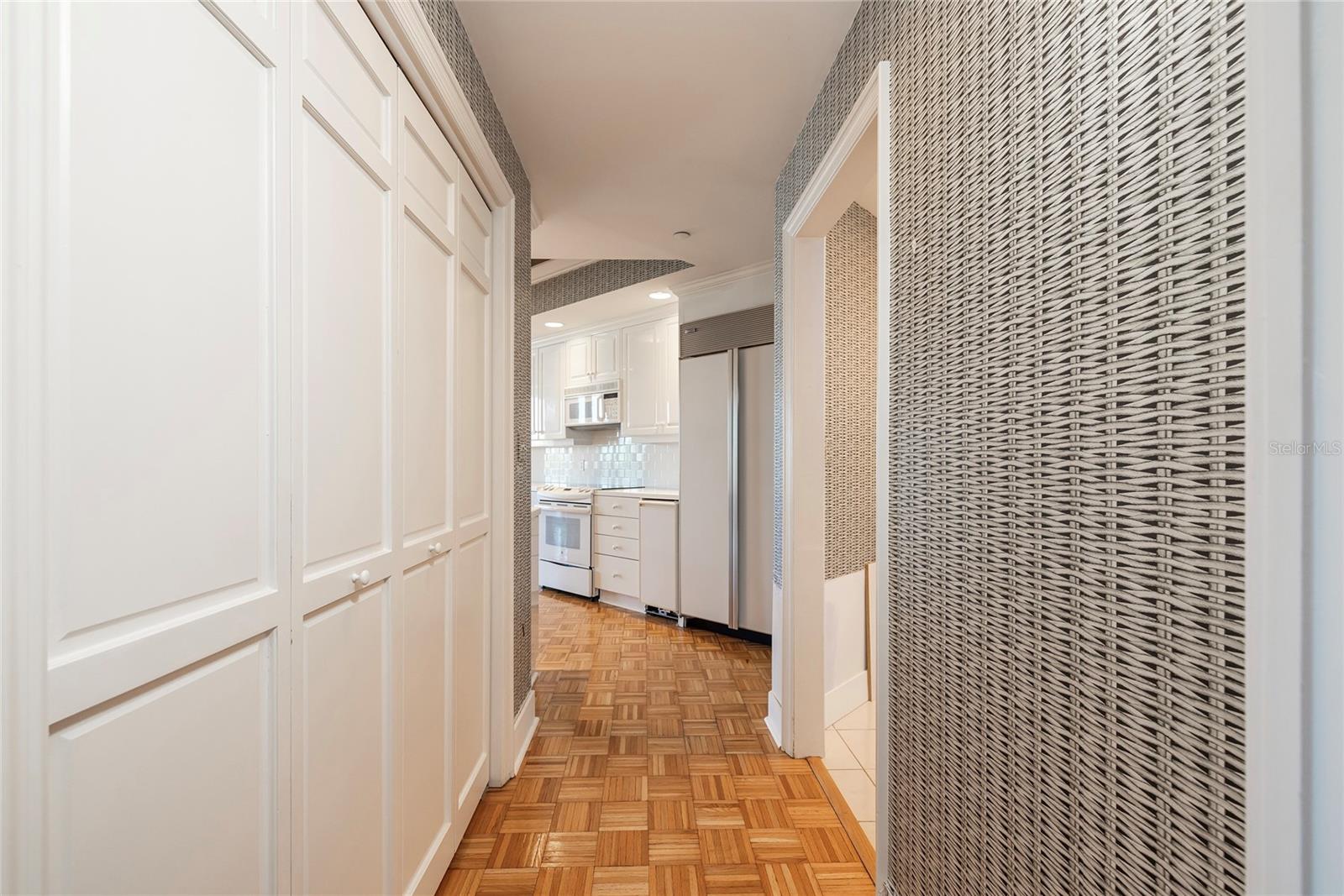 Kitchen Pantry on the left and Laundry Room entry on the right