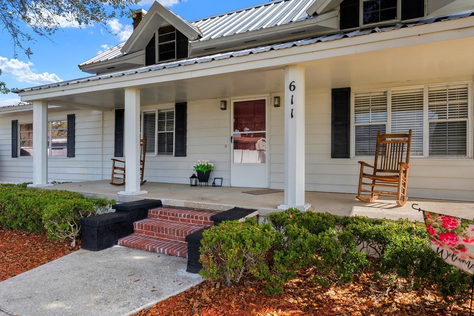 The front porch faces West and looks over the vast front yard.
