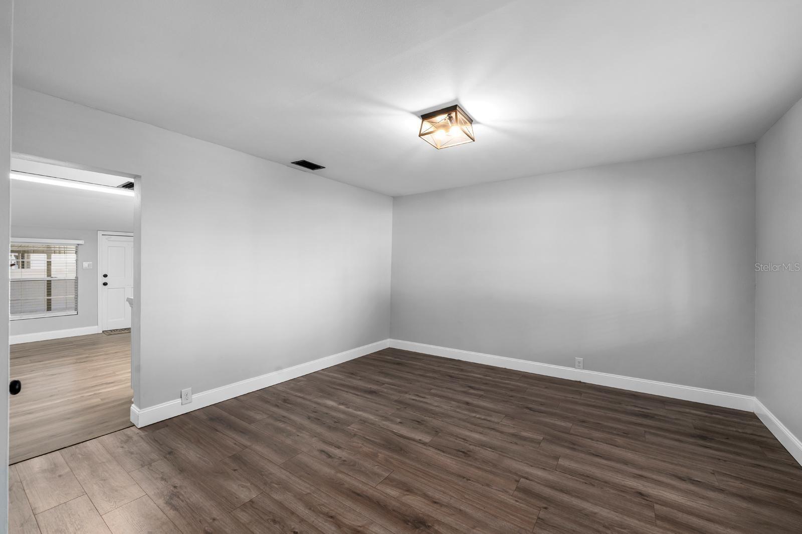 The dining room is spacious and can accommodate a very large table....this room could be also used as a second living room. You can see the HVAC (2022) closet here too.