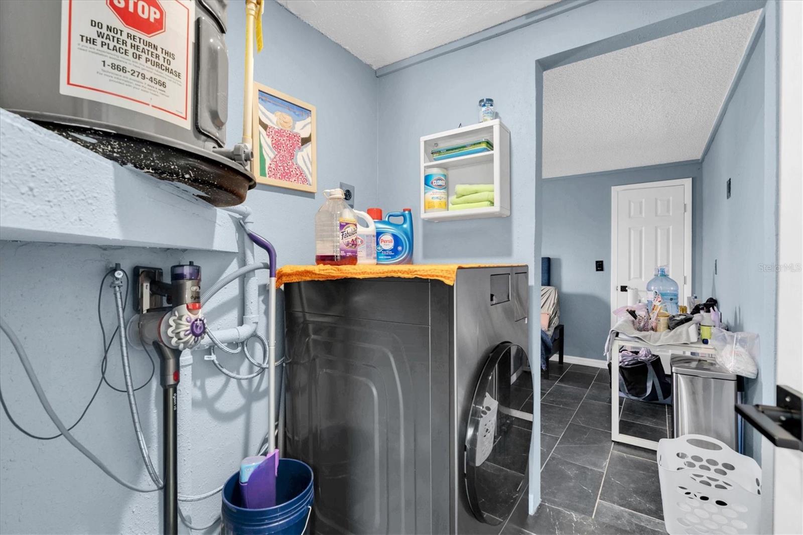 Washer/Dryer combo. Does fit a full size washer/Dryer