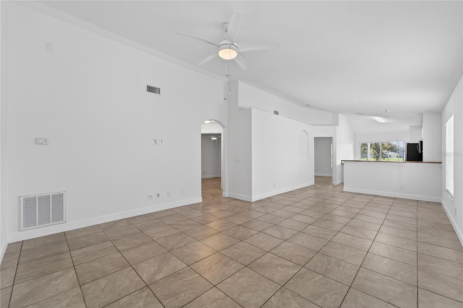 formal living/dining room and kitchen