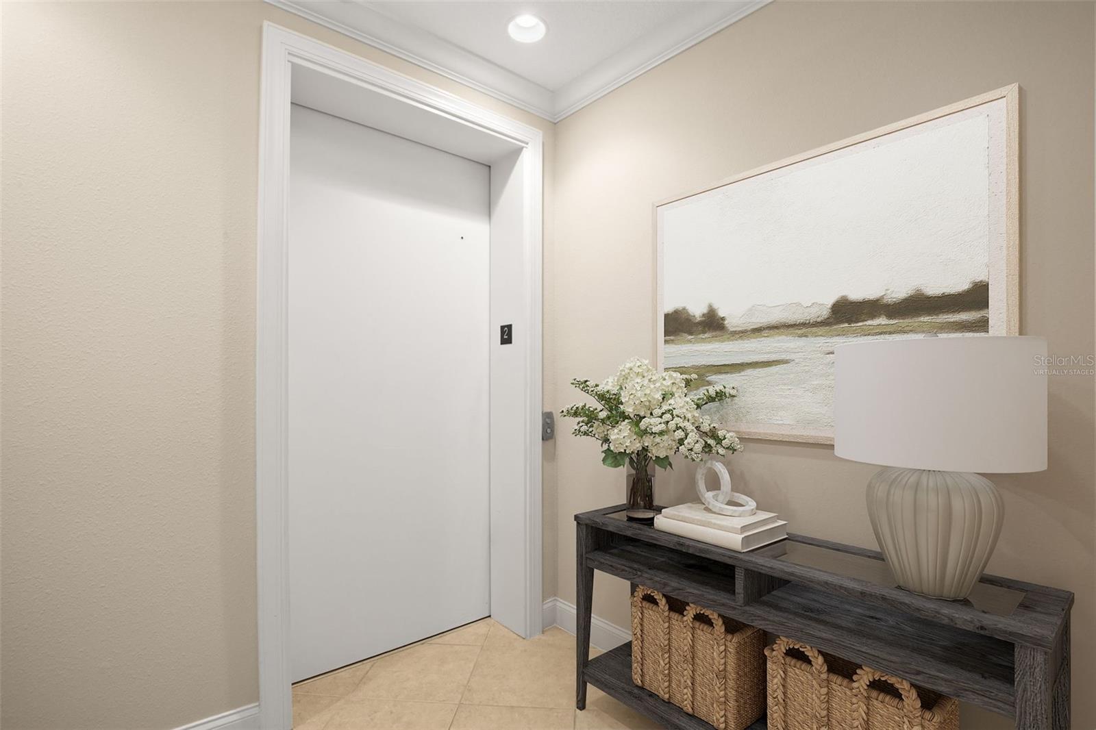 Virtually staged; private entry lobby as you step off the elevator into your home.