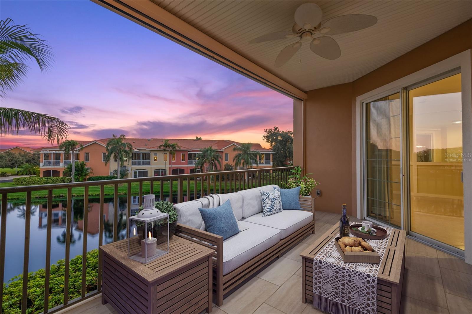 Virtually staged; Enjoy endless hours of sunset and sunrise views on Covered Terrace.  Note retractable roll-down screen feature.