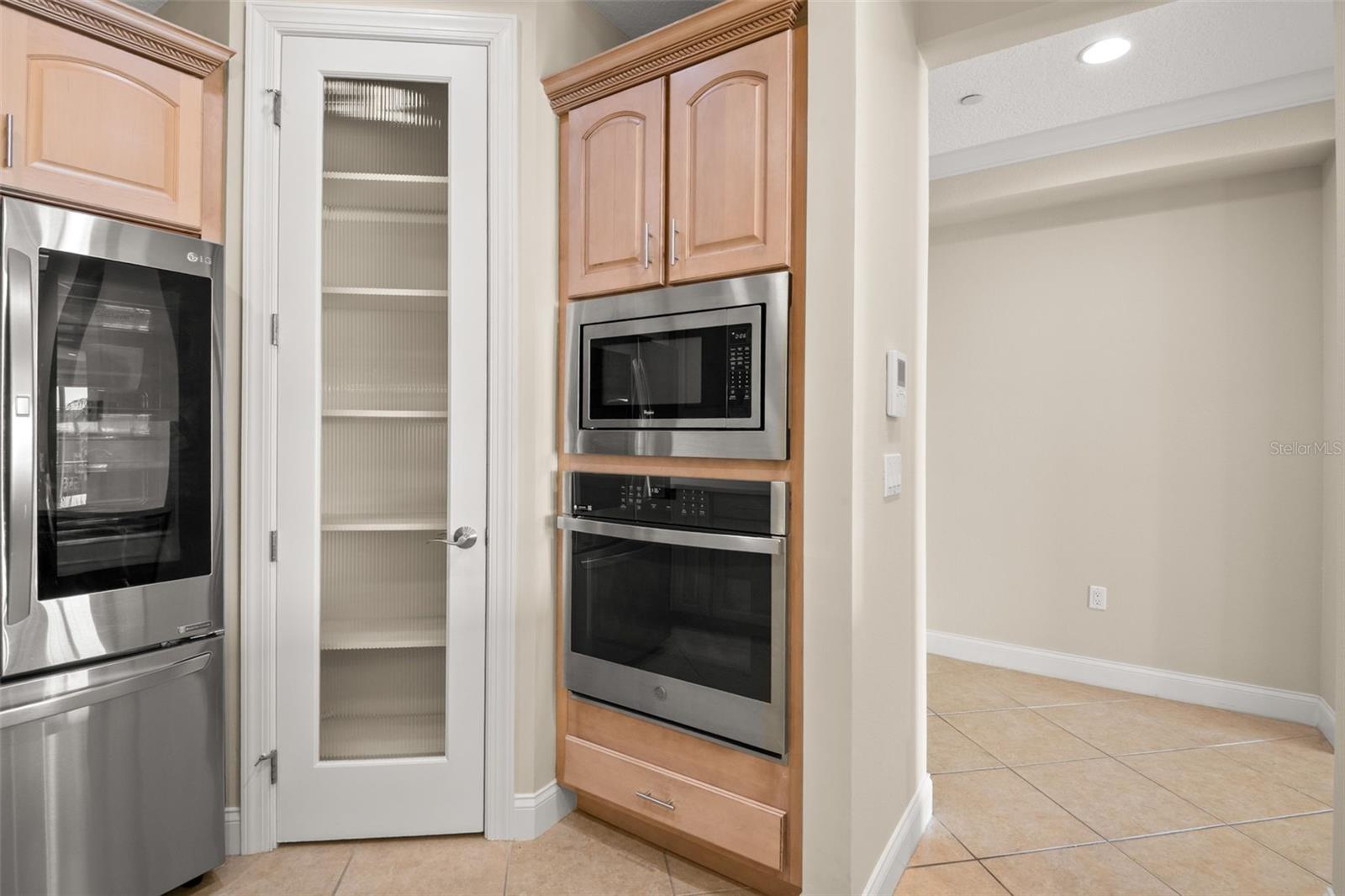Beautiful appliances in the Kitchen and just-the-right-size pantry closet.
