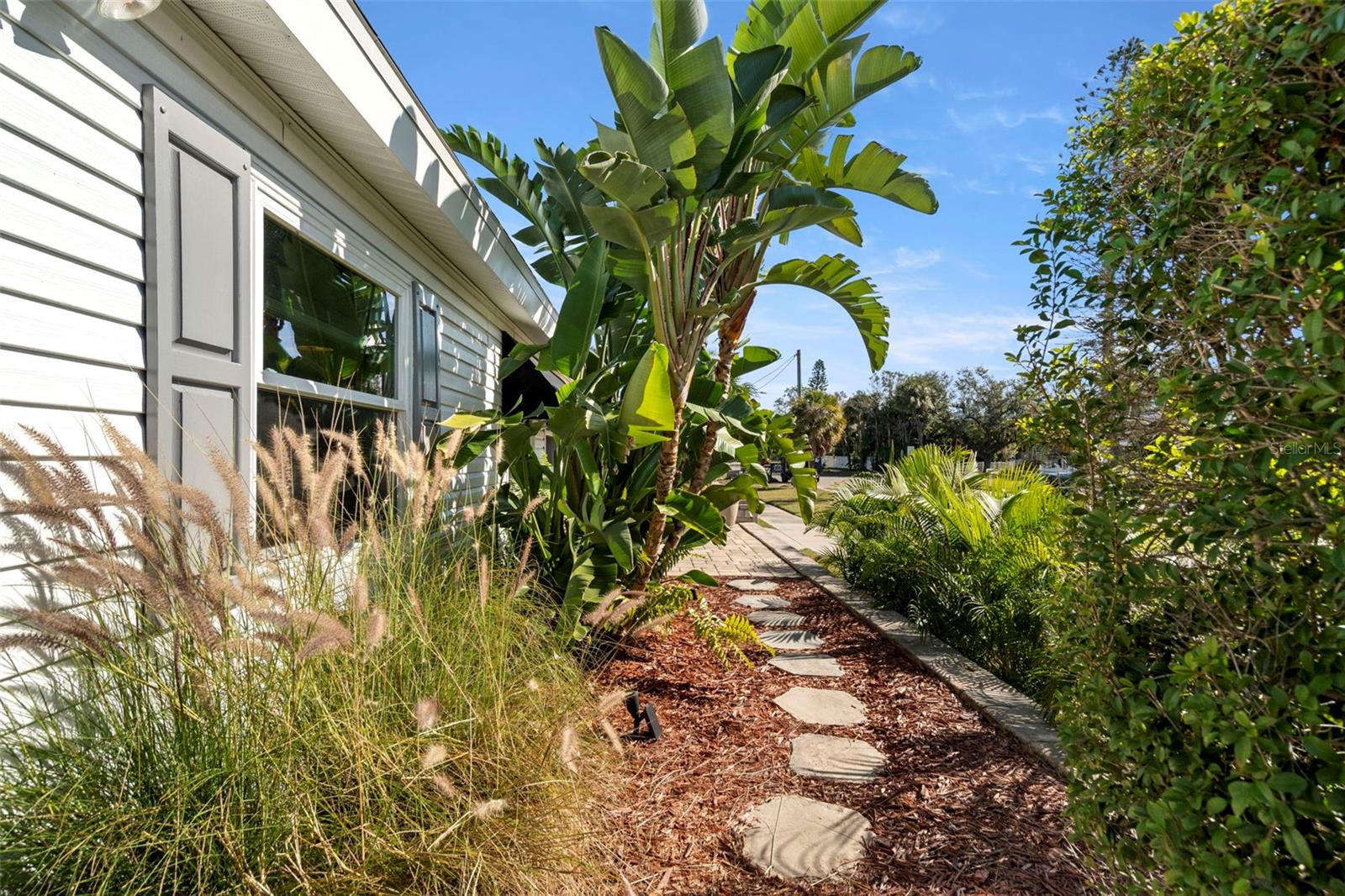 Walkway connecting two patios.
