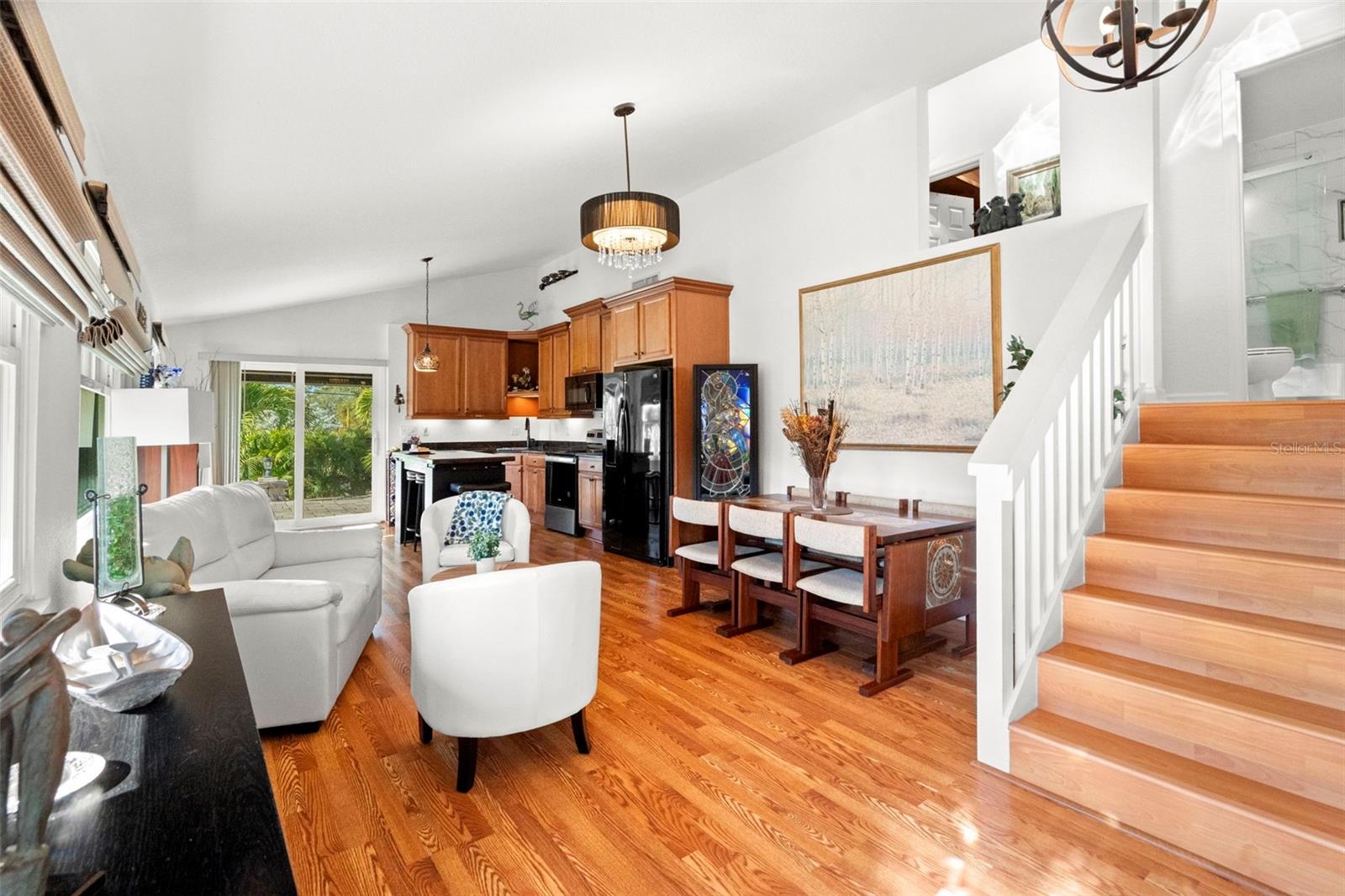 The open floor plan is defined by soaring ceilings.