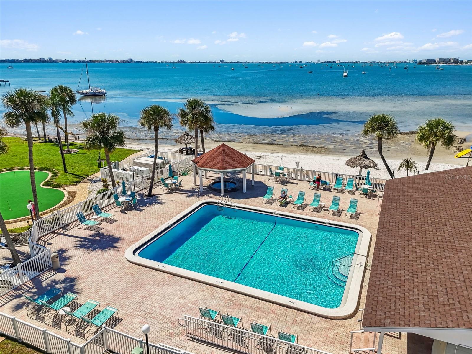 Beach side pool, spa, putting green, club house