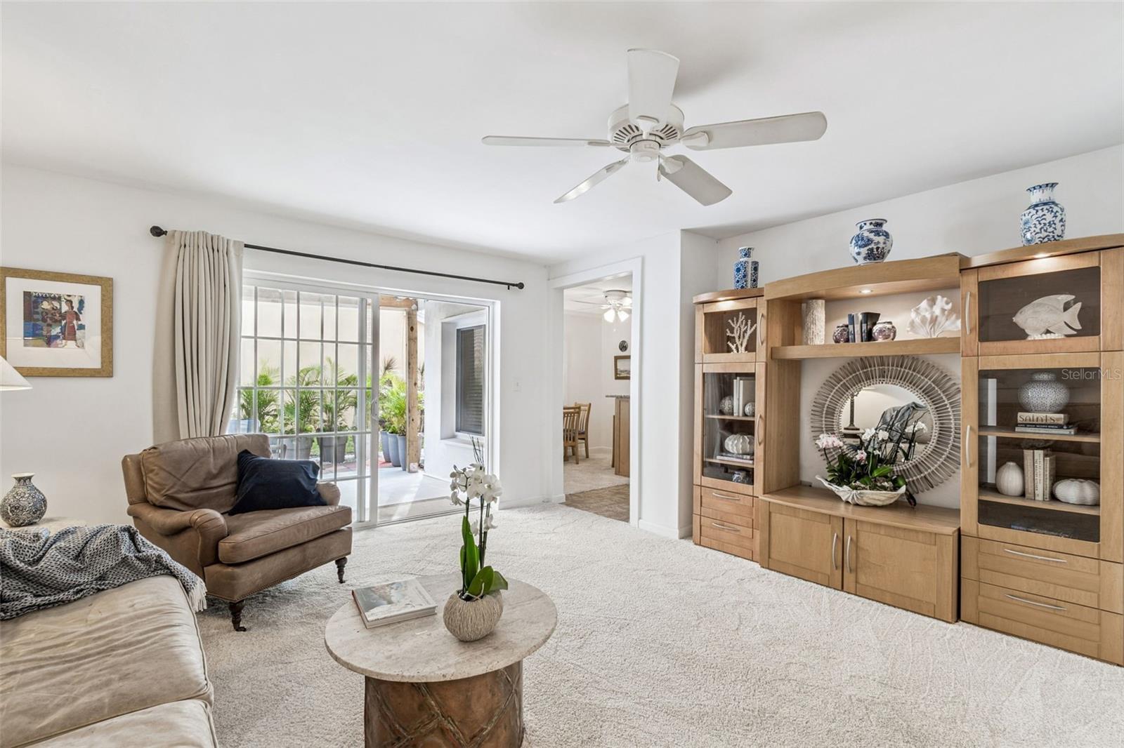 enjoy first floor living extending out to covered patio