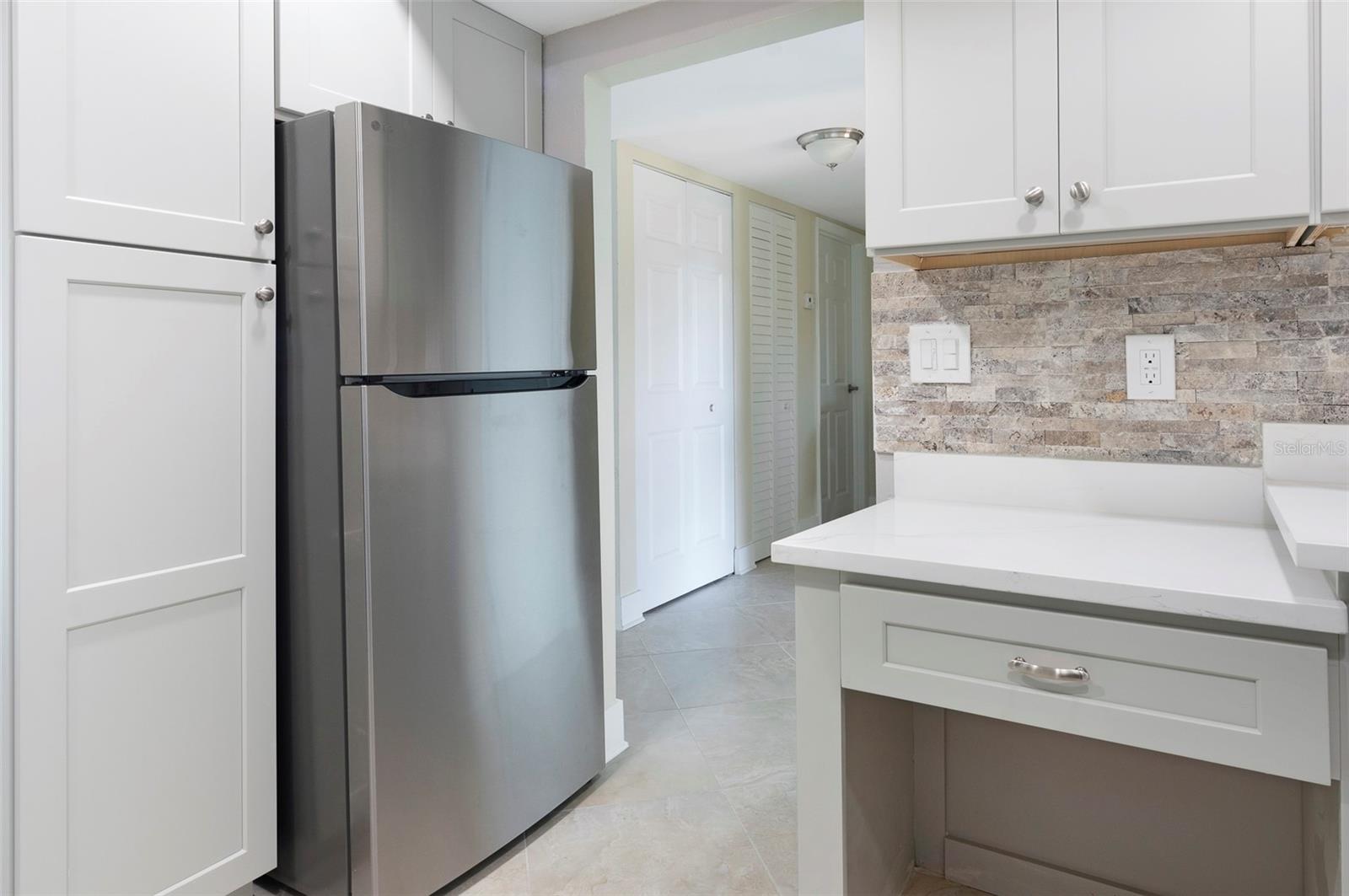New Refrigerator w/Ice maker, new Pantry cabinet, new desk area.