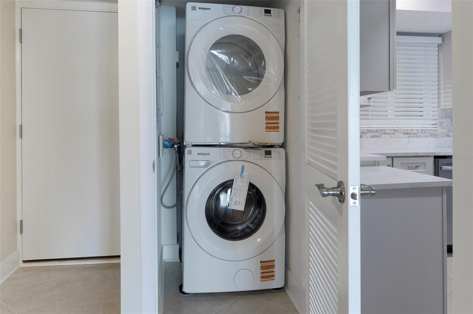 Brand New Washer & Dryer in laundry closet conveniently located beside the kitchen.