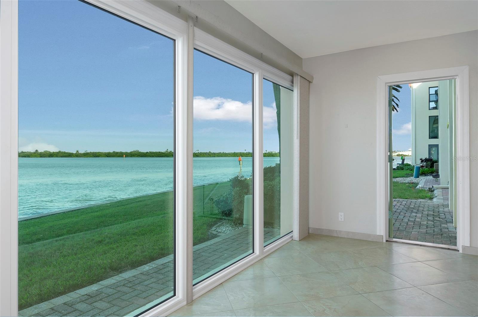 Right side view of Florida room. Door to outside opens to patio.