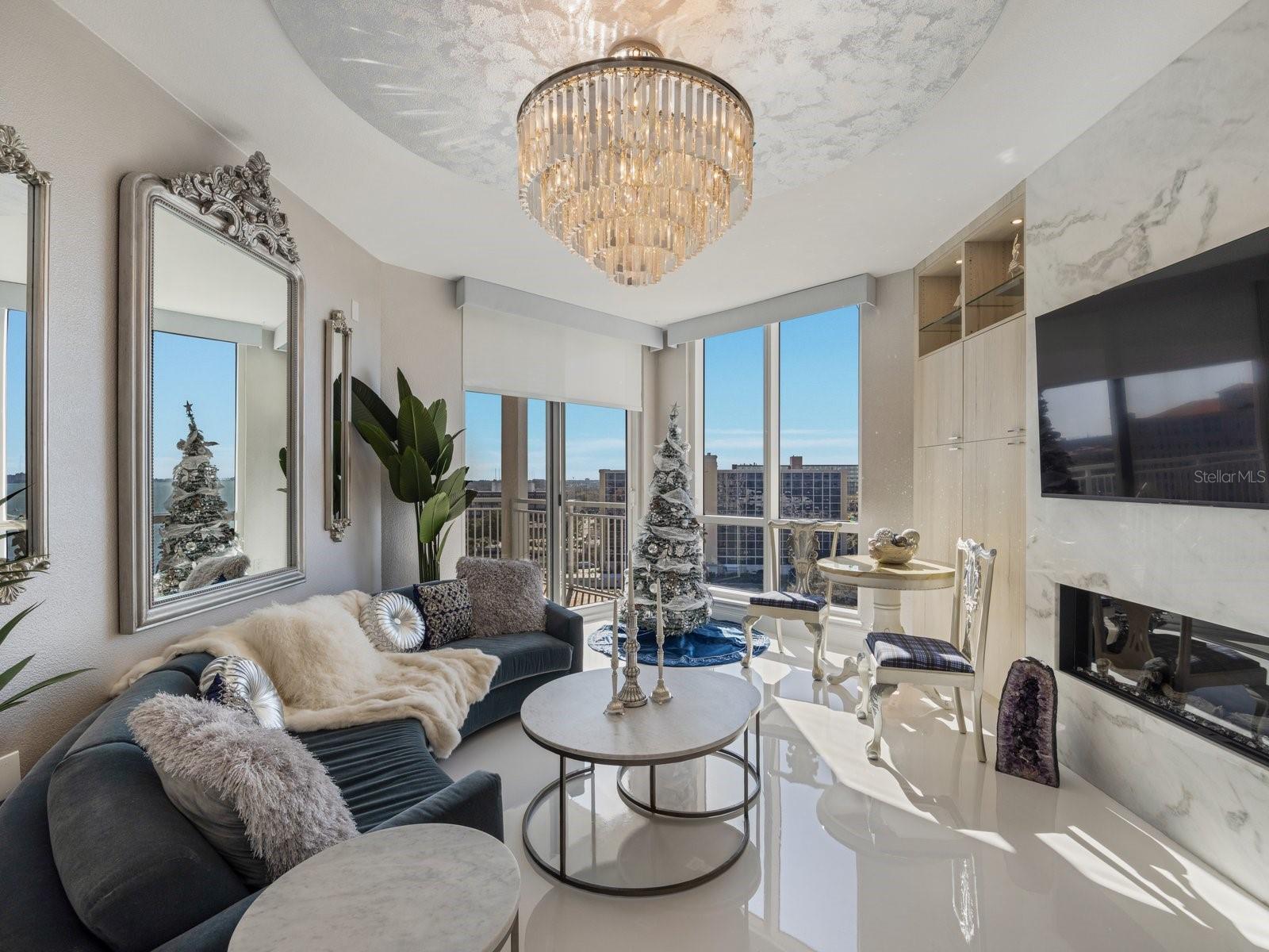 Living area with water views and automated shades