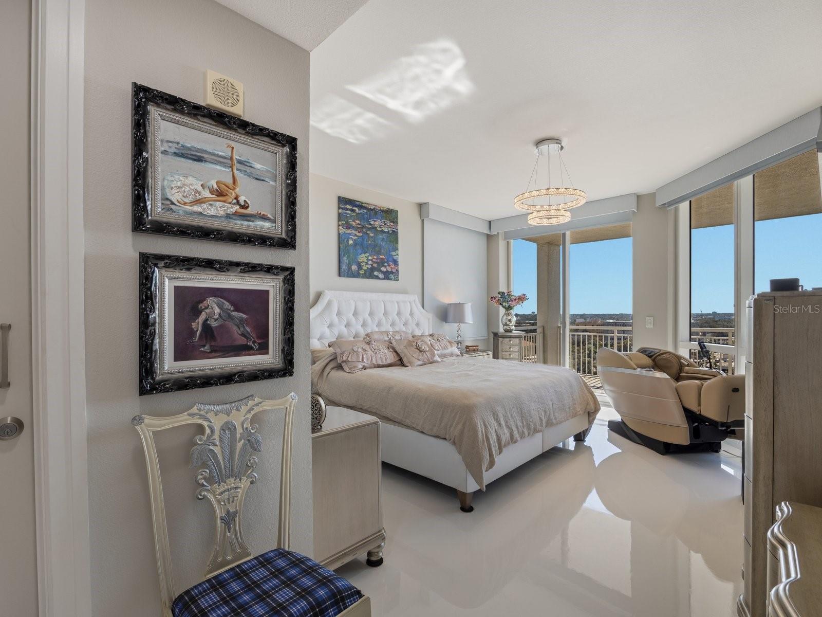 Primary bedroom with water views and automated shades