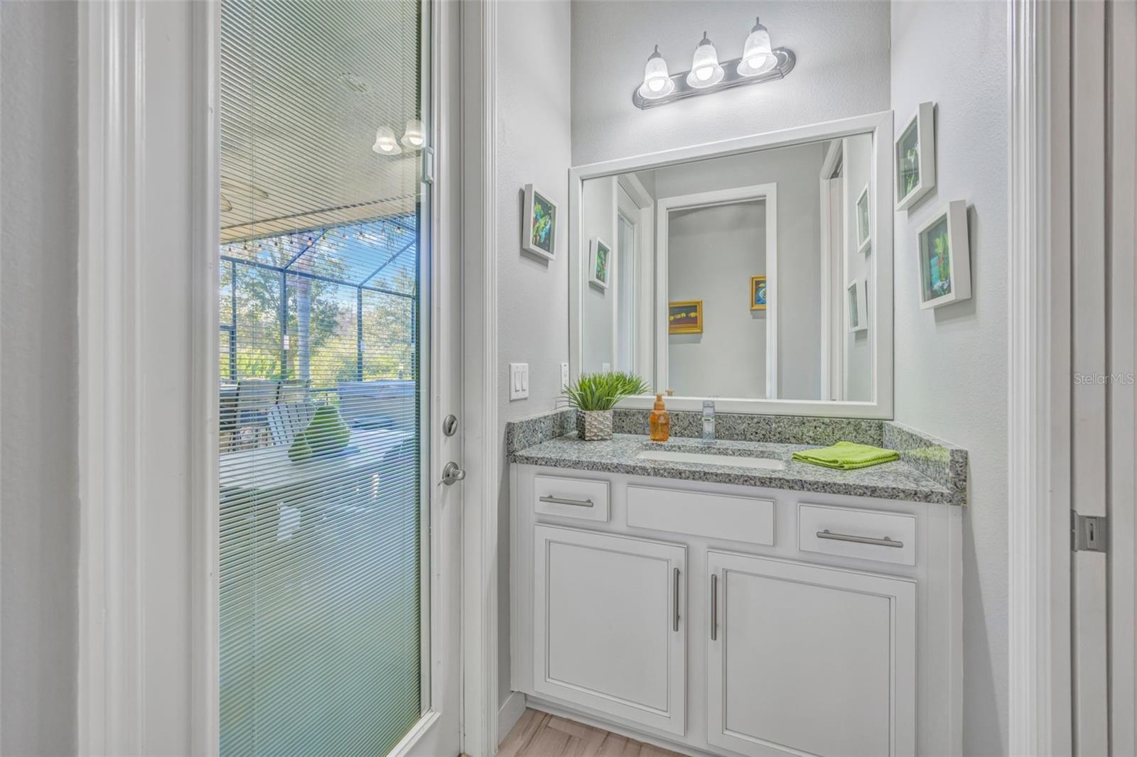 Hall to Pool Bath (1/2 Bath) and Primary Suite