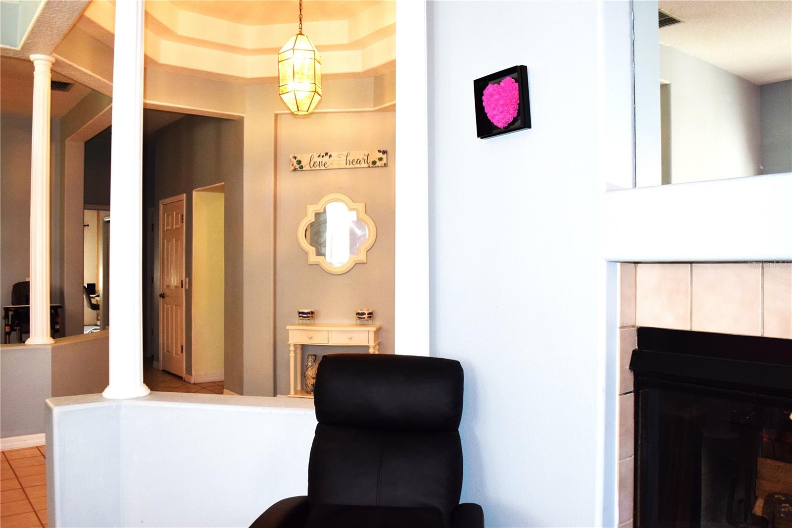 View of fire place from entry way