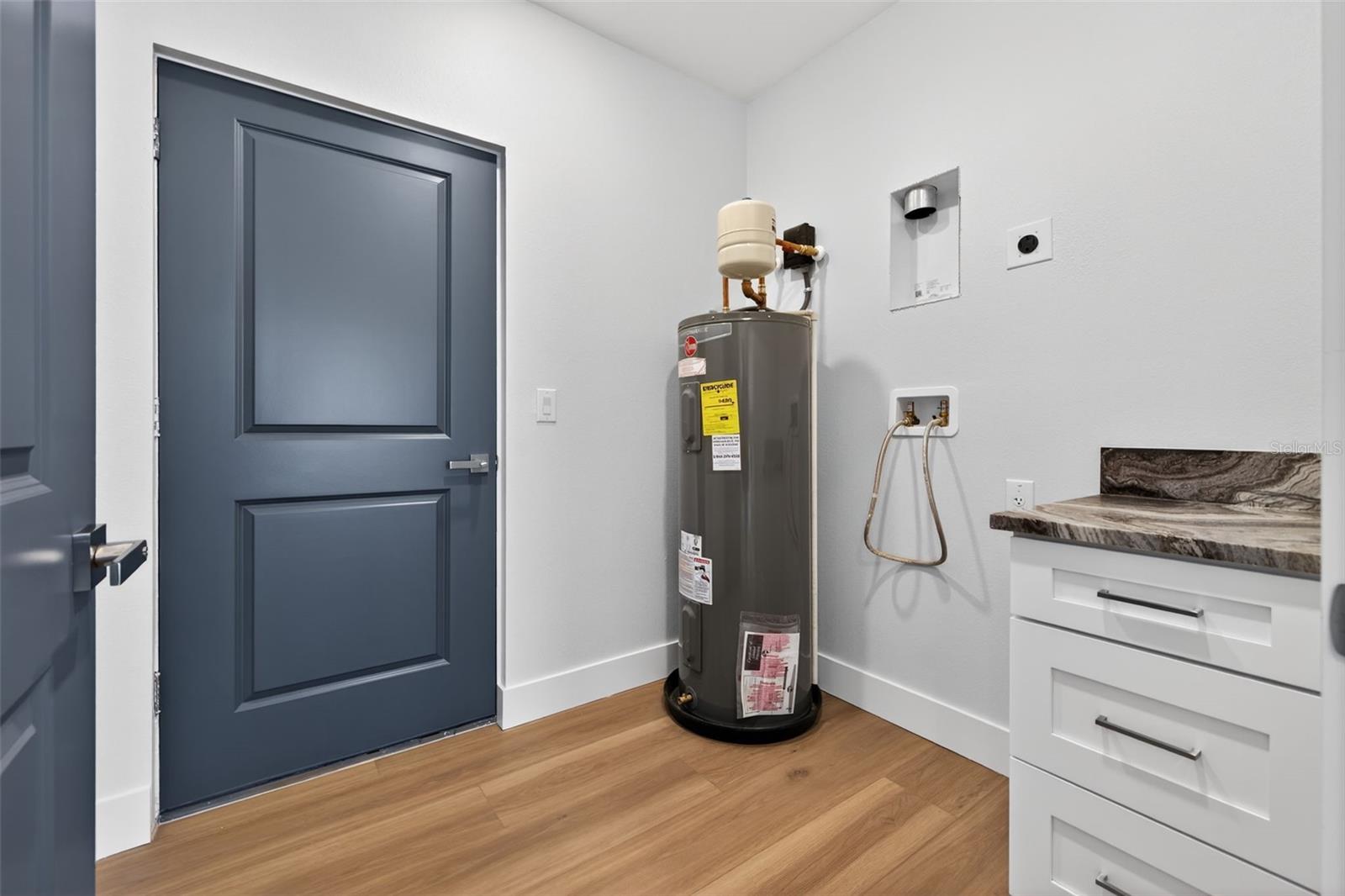 Entrance from garage and downstairs laundry