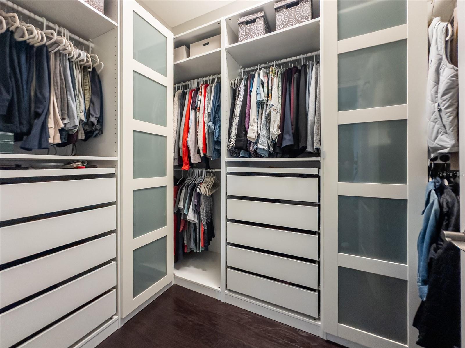 primary closet with custom built-ins